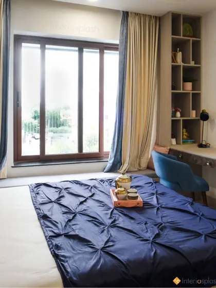 Another angle of the master bedroom, showing the built-in study area with open shelving. This makes the room a multi-functional and practical space.