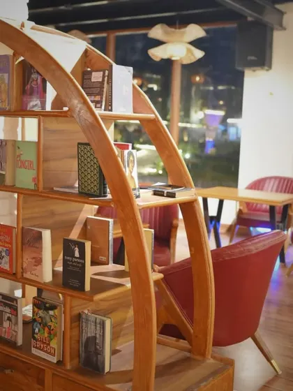 Our uniquely designed bookshelf, filled with books for you to browse. It's a popular photo spot too.