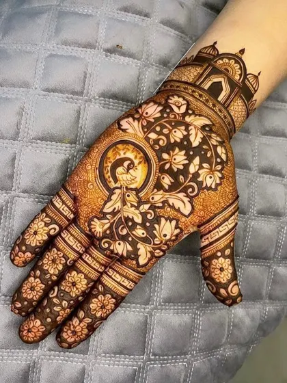 A beautiful single hand design for Karwa Chauth, featuring a peacock within a circular frame and an architectural cuff.