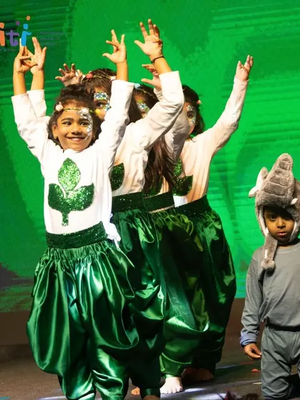 Children representing trees and animals dance together, celebrating the rich biodiversity of Bhumi (Earth).