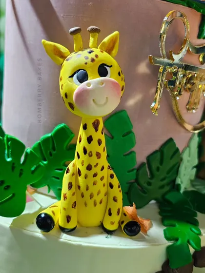 A sweet, hand-sculpted giraffe figurine with carefully painted spots. In my classes, you'll learn to create these popular safari animals from scratch.