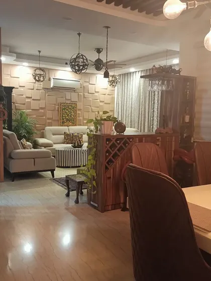 A wide view of the Bohemian-themed living and dining area, showing how all the unique elements come together to create a cohesive and personalized space.