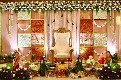 A beautiful, well-lit photograph of the grand Seemantha setup with a dry fruit panel backdrop. The symmetrical arrangement creates a sense of balance and harmony.