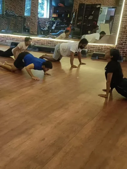 This view of the Cobra Pose shows the synchronized effort of the class as they follow my lead.