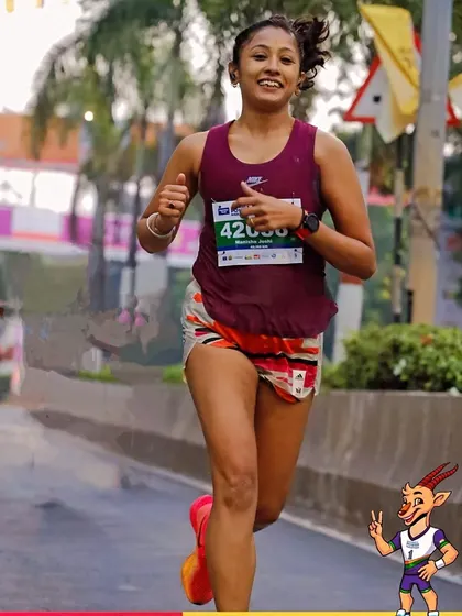 A smile and a thumbs-up mid-race. When you love the process, the race itself becomes a celebration of your hard work.