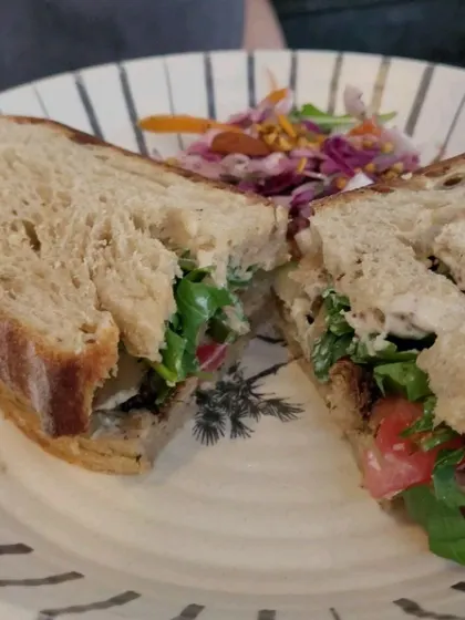 A closer look at the delicious Grilled Lion's Mane sandwich, a savory and satisfying option from our special festival menu.