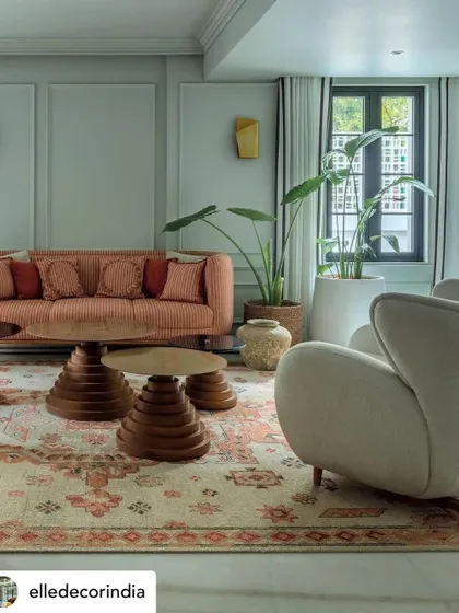 The den in Summer Haus, as featured in Elle Decor. The space was designed to be cozy and immersive, with rich colors and custom furniture that reflect the homeowners' creative spirit.