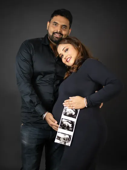 A beautiful way to include your little one in the photoshoot before they even arrive. The ultrasound strip adds a deeply personal touch to this couple's portrait.