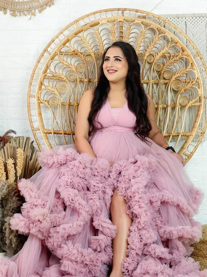 A variety of poses in a beautiful ruffled pink gown, showing its versatility for creating soft, romantic, and glamorous solo maternity portraits.