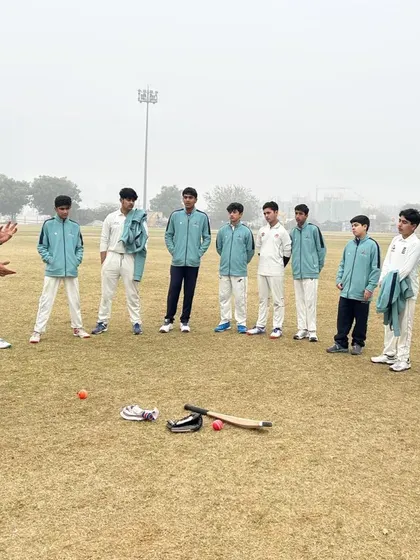 An on-field discussion about the day's training plan. We believe in clear communication, ensuring every player understands the objectives of each drill and session.