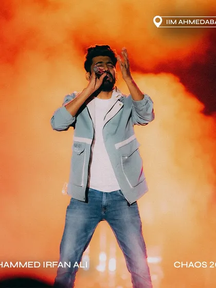 Mohammed Irfan Ali against a backdrop of fiery orange smoke at Chaos 2024.