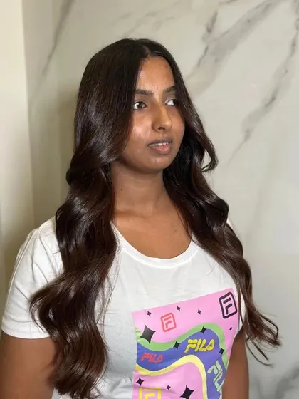 Changing my hair, changing my life. A happy client with her new rich, glossy hair.
