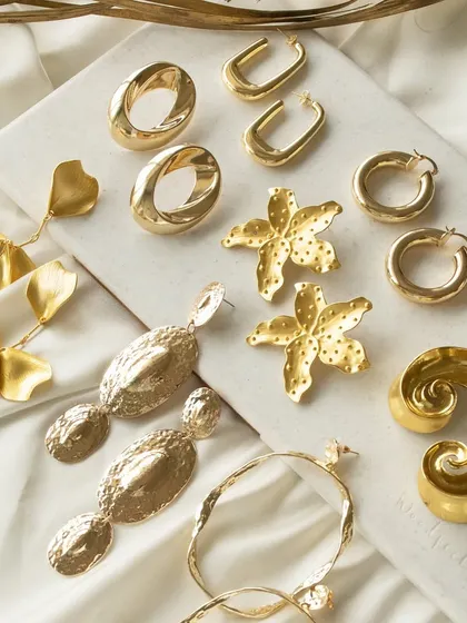 Another angle of my statement earring collection, showing the variety of shapes and textures that make each piece unique.