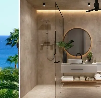 A modern bathroom design for a Goa villa, featuring textured concrete-finish walls and a minimalist floating vanity. The design captures a contemporary coastal charm, blending raw textures with clean lines for a spa-like feel.