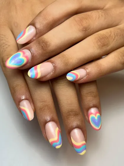 So much pastel love in one set. This design features retro-inspired heart shapes and swirls in soft shades of yellow, blue, and pink on a nude base.