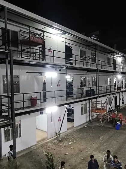 A night view of the completed G+2 prefabricated labor colony for Leighton India in Mumbai. This 22,322 sq. ft. project showcases our ability to deliver quality and efficiency on a large scale.