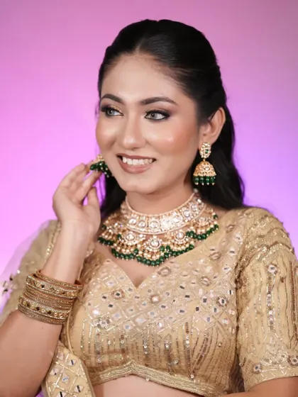 Because soft glam is always a good idea. This model looks radiant in a golden lehenga with soft, glowing makeup and a simple open hairstyle.