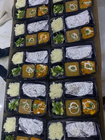 A top-down view of a large order ready to be dispatched. Each thali is carefully packed to ensure it reaches you in perfect condition.