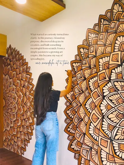 Here I am adding the final touches to a large, two part mandala mural. The earthy brown and orange tones were chosen to bring warmth and positive energy into the home's entryway.