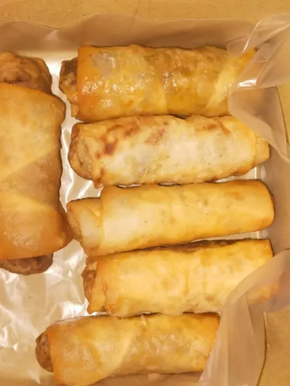 Classic Spring Rolls, available with both vegetable and non-vegetable fillings. They are fried until golden and crispy, perfect for passing around at any event.