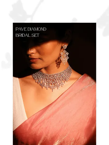 This Pave Diamond Bridal Set offers a breathtaking display of pure brilliance. Worn here, the necklace and earrings create a cohesive look of cascading light, perfect for a glamorous bridal statement.