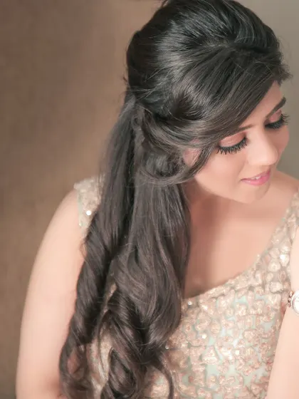 A close-up portrait focusing on the bride's soft expression and beautiful hairstyle. These gentle portraits are a wonderful part of the wedding album.