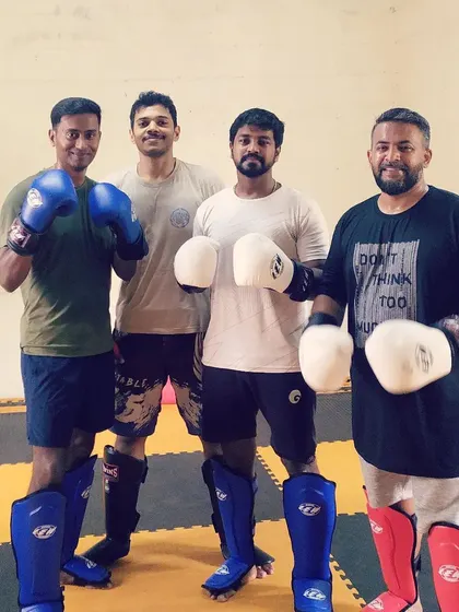 The weekend kickboxing team after a tough session. We train hard together and support each other's progress.