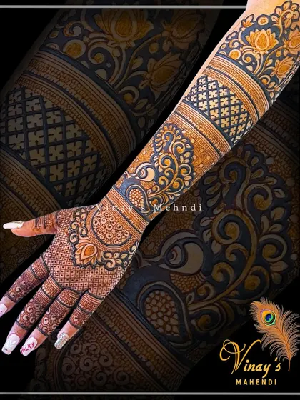 A stunning back-hand design with bold, dark patterns. The peacock and floral motifs are highlighted by the use of negative space.
