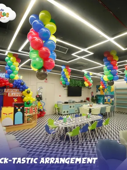 A wide view of our party hall decorated for an Angry Birds theme. The colorful balloon arrangements and themed table setups show how I transform the entire space to match your child's dream.