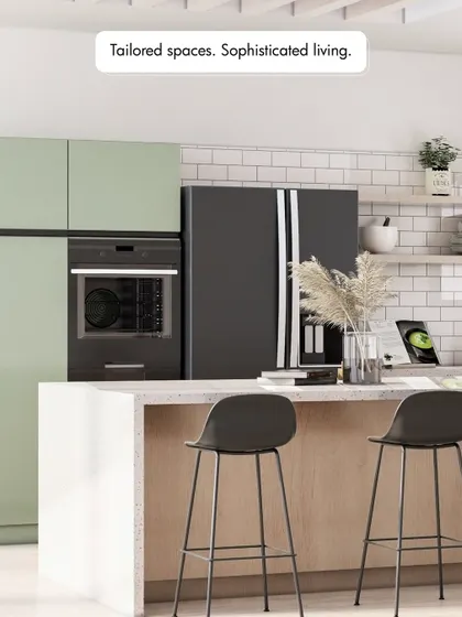 Tailored spaces for sophisticated living. This kitchen combines light green cabinets with a white subway tile backsplash and a wooden island base, creating a fresh, modern, and inviting atmosphere.