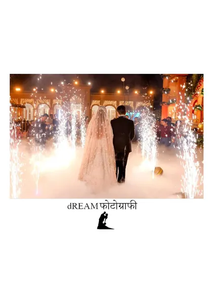 A magical exit shot of Tanu and Kunal walking away through a path of cold pyro fireworks.