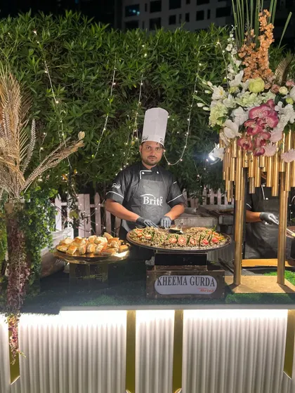 The full Kheema Gurda counter, showcasing the dish and the professional chef in charge.