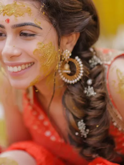 A close-up of the bride's joyful smile during her Haldi ceremony in Jaipur.