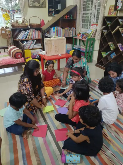 Children learn the basics of origami by making their own paper birds that can "fly," a perfect craft after a story about cockatoos.