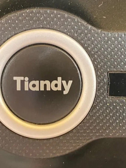A close-up of the Tiandy NVR power button, emphasizing the brand I rely on for my projects.