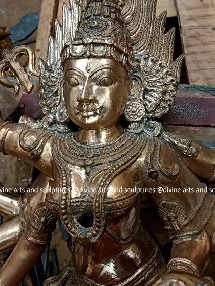 A close-up of a Bhadrakali sculpture during the finishing stage. After casting, countless hours are spent chasing, chiseling, and polishing the metal to define the intricate details you see on her face and jewelry.