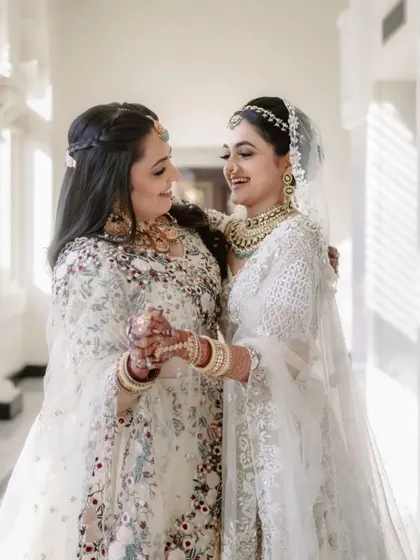 A bride sharing a laugh with her sister. The bond between siblings is a special part of any wedding celebration.