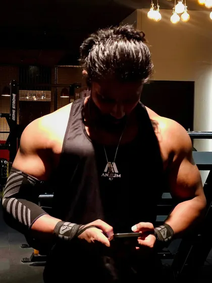 Every rep builds the beast. Here I am checking my plan between sets, ensuring every part of the workout has a purpose.