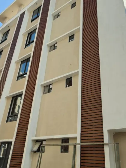 Here, our wood-finish metal louvers add warmth and texture to this building's elevation. It's a perfect example of how we use cladding to break the monotony of a plain wall and add character.