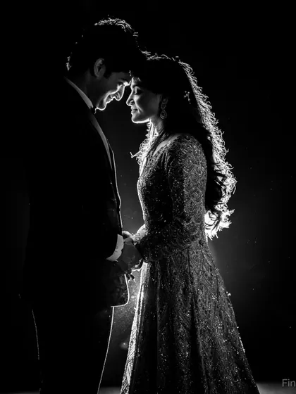 A stunning black and white silhouette, where the backlighting beautifully outlines the couple and creates a feeling of timeless romance.