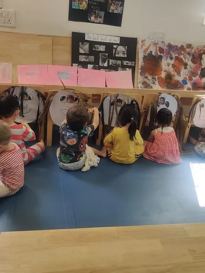 Welcome to our pretend salon. As part of our unit on community helpers, children sit in a row and practice their "hairstyling" skills by cutting paper hair.