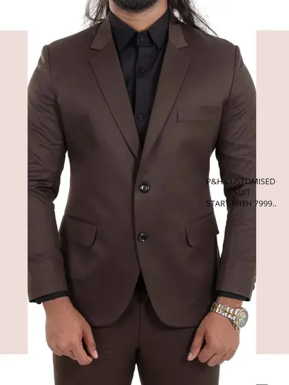 A close-up of the brown suit jacket, a timeless piece for any formal occasion.