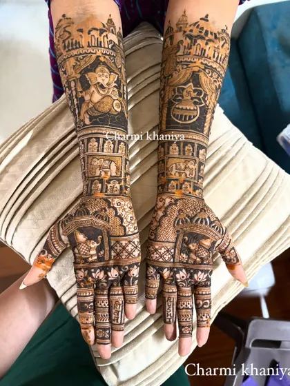 A closer view of the divine Ganesha and kalash mehendi. You can see the intricate details in the architecture and the expressive features of Lord Ganesha.