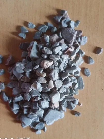 A pile of unpolished grey pebbles, perfect for filling garden beds, pathways, or creating a base for potted plants.