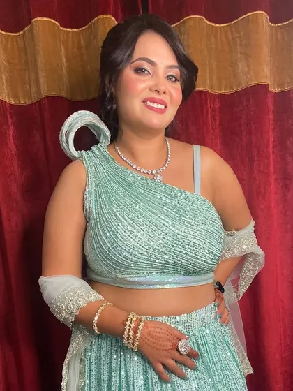 This client is glowing for her Karva Chauth celebration. We created a fresh and radiant makeup look with a pink lip to match her sparkling mint green lehenga.