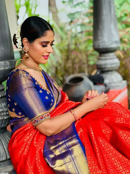A seated portrait of me, the rich colors of the saree creating a beautiful picture.