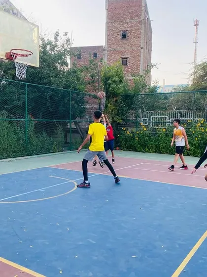 A junior player takes a shot, building confidence and proper shooting mechanics.