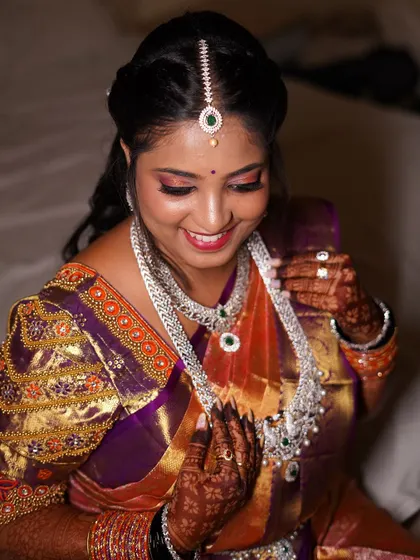 A close-up of the reception makeup, showing the shimmering eyeshadow and flawless skin finish. Her smile truly shows she shined from within.