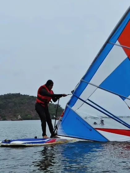 Learning to recover is part of the process. A windsurfer practices pulling his sail out of the water.