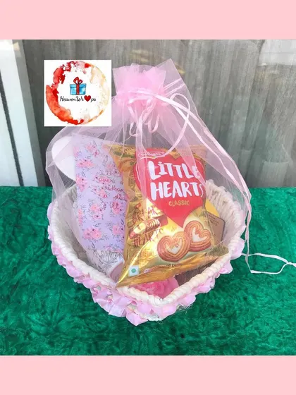 Our heart-shaped Valentine's basket, neatly wrapped in a pink organza bag, ready for gifting.